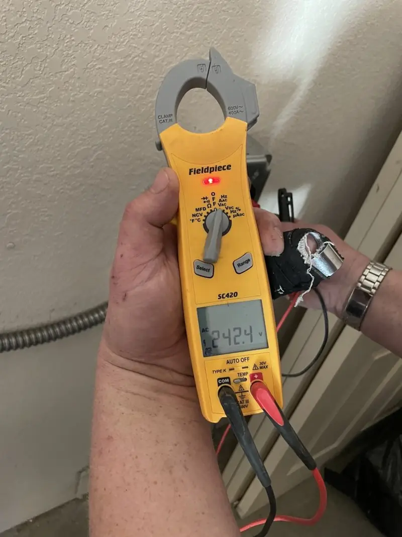 Voltage testing with clamp meter during Outlet Installation in Whetstone